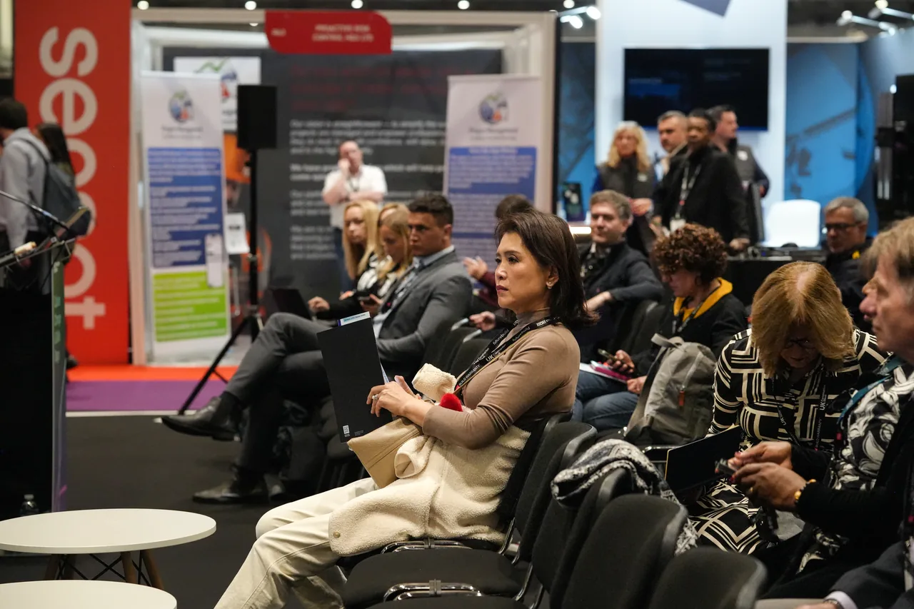 Audience members listening to a construction presentation at UK Construction Week