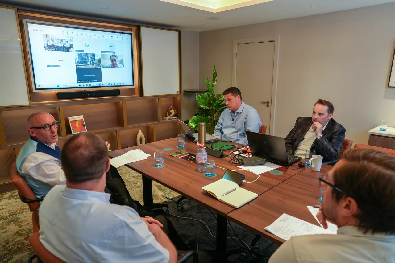 Participants seated around a table during a focused working session